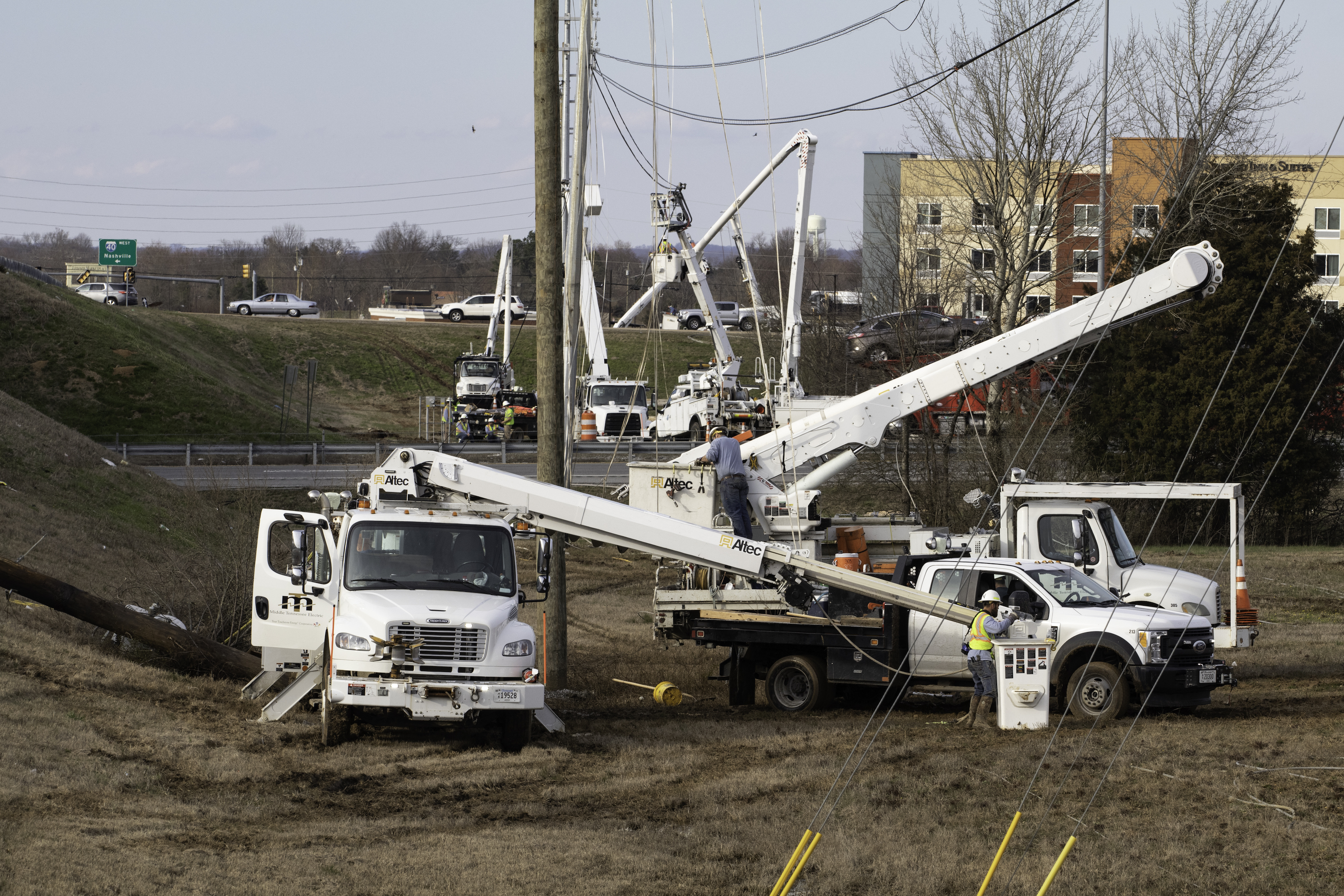 Line crews work to restore power across an interstate