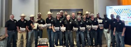 MTE lineman take photo at 2026 rodeo banquet