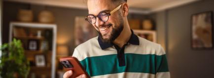 man on his phone at home