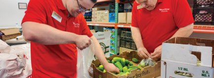 two people working at a sharingchange grant awarded organization