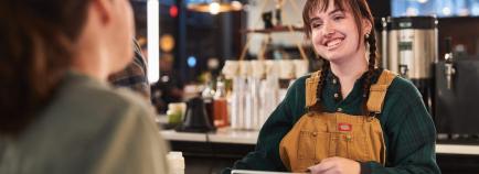 barista at coffee shop with customer